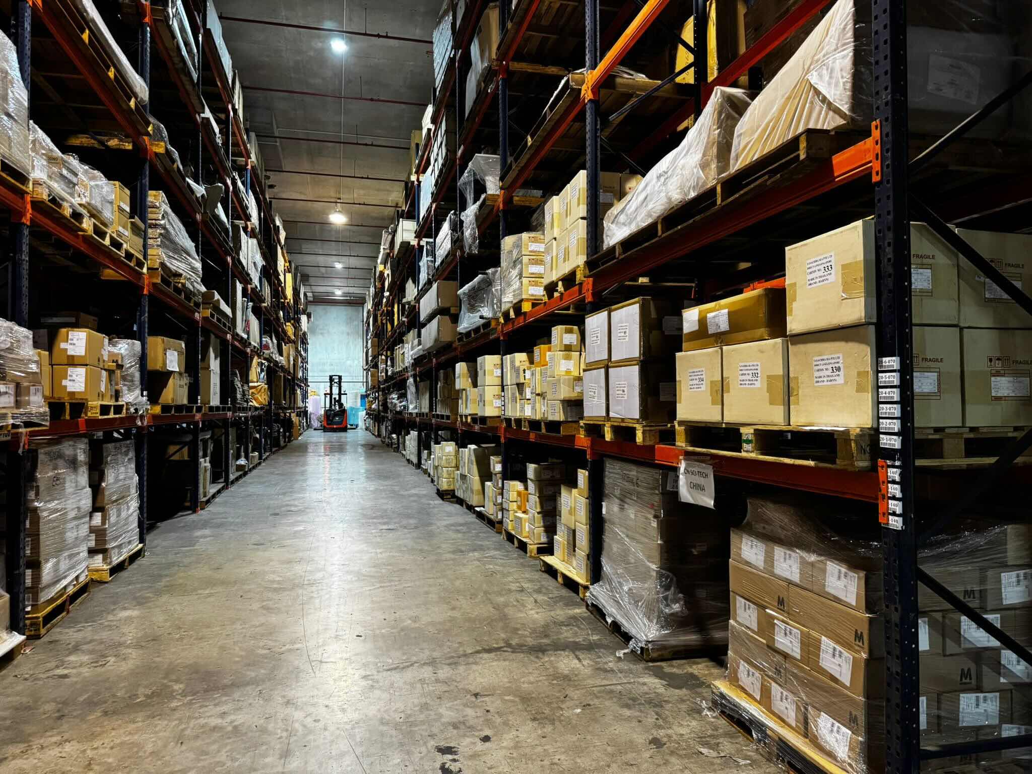 Professional furniture delivery team loading furniture with specialized equipment in Singapore