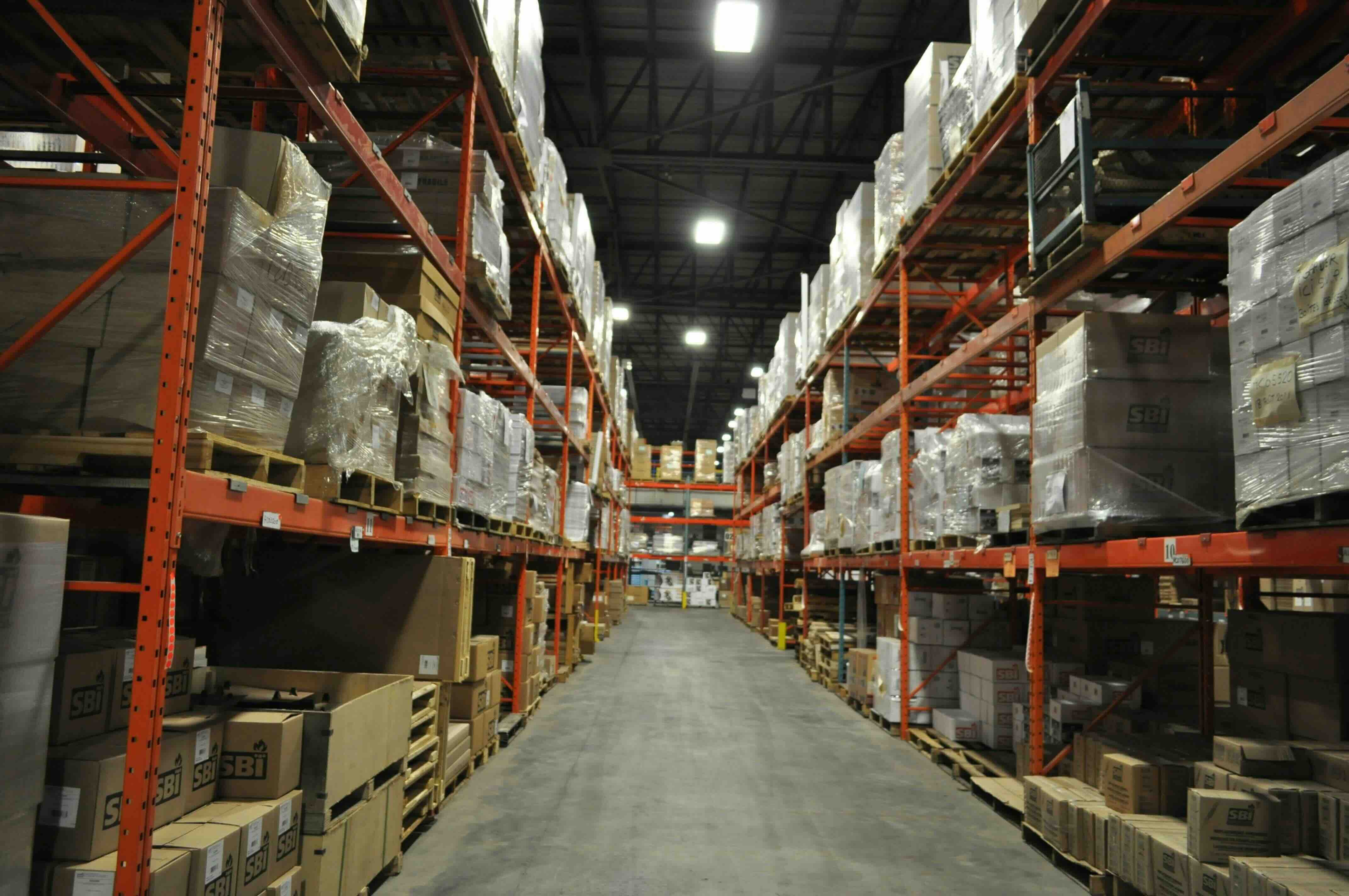 Renford Logistics warehouse and distribution center with furniture delivery trucks